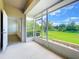 Relax on the screened porch with views of the green lawn and landscaping at 2092 Switch Grass Cir, Ocoee, FL 34761