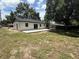 Spacious backyard featuring a concrete patio, perfect for outdoor entertaining and relaxation at 212 Dorothy St, Auburndale, FL 33823