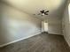 Spacious bedroom featuring a ceiling fan and wood-look tile floors at 212 Dorothy St, Auburndale, FL 33823