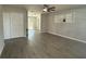 Open-concept living space with modern tile flooring, neutral walls, storage closet, and views to the backyard at 212 Dorothy St, Auburndale, FL 33823