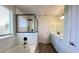 Bright bathroom features a soaking tub with subway tile surround and a glass enclosed shower at 2183 Leather Fern Dr, Ocoee, FL 34761