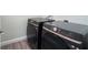 Laundry room with a modern, front-loading washer and dryer at 2183 Leather Fern Dr, Ocoee, FL 34761