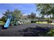 Community playground offers various slides and swings for neighborhood enjoyment at 2183 Leather Fern Dr, Ocoee, FL 34761