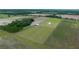 Aerial shot of the property featuring a house, barn, and expansive land at 22212 Sw 210Th Ave, Dunnellon, FL 34431