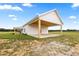 Stunning new backyard with a large porch at 22212 Sw 210Th Ave, Dunnellon, FL 34431