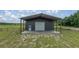 Close up shot of the barn and surrounding field at 22212 Sw 210Th Ave, Dunnellon, FL 34431
