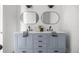 Stylish bathroom with double sinks, custom vanity, black hardware, and decorative accents at 22212 Sw 210Th Ave, Dunnellon, FL 34431