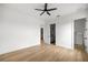 This bedroom has wood floors, white walls and a ceiling fan at 22212 Sw 210Th Ave, Dunnellon, FL 34431