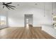 Spacious living room with vaulted ceilings and wood floors leading to the hallway and kitchen at 22212 Sw 210Th Ave, Dunnellon, FL 34431