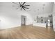 Spacious living room with vaulted ceilings and an open floor plan to the kitchen and dining area at 22212 Sw 210Th Ave, Dunnellon, FL 34431
