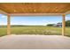Spacious porch with wood ceiling overlooking the expansive yard at 22212 Sw 210Th Ave, Dunnellon, FL 34431