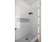 This modern walk-in shower features a rain shower head, and stylish gray tile at 22212 Sw 210Th Ave, Dunnellon, FL 34431