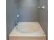 Enclosed tub-shower combination in a bathroom featuring neutral tile at 2241 Retreat View Cir, Sanford, FL 32771