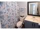 Well-maintained bathroom featuring a neutral-toned shower curtain and a coordinating hand towel at 2241 Retreat View Cir, Sanford, FL 32771
