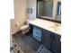 Bathroom with a new gray vanity, modern flooring, and a large mirror at 2241 Retreat View Cir, Sanford, FL 32771