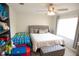 Bright bedroom with a comfortable bed, ceiling fan, and ample natural light at 2241 Retreat View Cir, Sanford, FL 32771