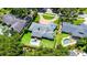 Overhead view of a home featuring a pool, large yard, patio, and circular driveway at 2527 Shrewsbury Rd, Orlando, FL 32803