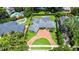A beautiful single-story home features a brick driveway, well-manicured lawn, and a private backyard pool at 2527 Shrewsbury Rd, Orlando, FL 32803