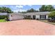 Charming single-story home with a brick driveway, a two-car garage, and a well-manicured lawn at 2527 Shrewsbury Rd, Orlando, FL 32803