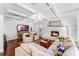 Cozy living room features a fireplace, hardwood floors, coffered ceilings, and comfortable seating at 2527 Shrewsbury Rd, Orlando, FL 32803