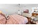 Bright main bedroom boasts hardwood floors, a ceiling fan, and a view of an en-suite bathroom at 2527 Shrewsbury Rd, Orlando, FL 32803