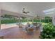 Backyard patio with outdoor seating, ceiling fans, a dining area, and a view of the pool at 2527 Shrewsbury Rd, Orlando, FL 32803