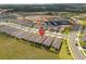 A home in a new neighborhood under construction, seen from an aerial view at 2759 Purple Meadow Ct, Minneola, FL 34715