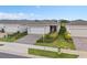 Aerial view of a single-Gathering home with manicured landscaping and a two-car garage at 2759 Purple Meadow Ct, Minneola, FL 34715