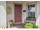 Welcoming front entrance featuring a brick-paved porch, a decorative bench, and a solid wood door at 2759 Purple Meadow Ct, Minneola, FL 34715
