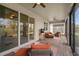 Relaxing covered patio with brick flooring, ceiling fan, and outdoor furniture at 2759 Purple Meadow Ct, Minneola, FL 34715