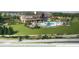 A rendering of the community pool and clubhouse showcasing the amenities and outdoor recreation area at 2759 Purple Meadow Ct, Minneola, FL 34715
