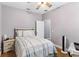 Cozy bedroom with ceiling fan, and an open doorway at 308 Clearwater Ln, Poinciana, FL 34759