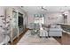 Comfortable living room showcases a plush sofa set, decorative display case, and large window at 308 Clearwater Ln, Poinciana, FL 34759