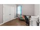 Functional office space with a comfortable couch, desk, and natural light from the window at 308 Clearwater Ln, Poinciana, FL 34759