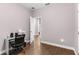 Versatile office space with a modern desk, ergonomic chair, and easy access to the hallway at 308 Clearwater Ln, Poinciana, FL 34759