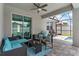 Inviting patio with comfortable seating, ceiling fan, and seamless access to the sparkling pool at 308 Clearwater Ln, Poinciana, FL 34759