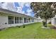 Spacious backyard featuring lush green grass and mature tree at 3415 Celena Cir, St Cloud, FL 34769