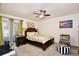 Bedroom with ceiling fan, floral bedding, and sliding door with access to outside at 3415 Celena Cir, St Cloud, FL 34769