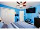 Comfortable bedroom featuring a ceiling fan, closet space and lots of natural light at 3415 Celena Cir, St Cloud, FL 34769