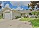 Inviting single-story home with a well-manicured lawn and a welcoming entrance at 3415 Celena Cir, St Cloud, FL 34769