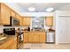 Functional kitchen featuring stainless steel appliances, granite countertops, and ample cabinet space at 3415 Celena Cir, St Cloud, FL 34769