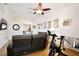 Open-concept living room with exercise bike, ceiling fan, and seamless access to the dining area at 3415 Celena Cir, St Cloud, FL 34769