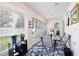 Sunroom filled with lots of natural light, blue and white rug, and plants at 3415 Celena Cir, St Cloud, FL 34769