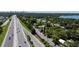 Aerial view of property near highway with trees and other homes at 3914 W Robinson St, Orlando, FL 32805