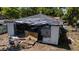 Exterior shot of the property shows an old home that is boarded up and falling apart at 3914 W Robinson St, Orlando, FL 32805