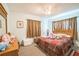 Cozy bedroom with ample natural light, plush carpet, and closet at 426 Illinois Ave, St Cloud, FL 34769