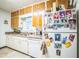 Efficient kitchen with a double sink, white appliances, wood cabinets, and ample counter space at 426 Illinois Ave, St Cloud, FL 34769