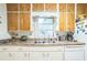 Practical kitchen with white cabinetry, and ample counter space overlooking the sink at 426 Illinois Ave, St Cloud, FL 34769