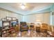 Cozy sunroom-style living room with lots of natural light at 426 Illinois Ave, St Cloud, FL 34769