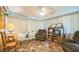 Bright and airy sunroom-style living room with wall-to-wall window at 426 Illinois Ave, St Cloud, FL 34769